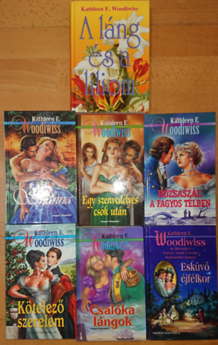 Kathleen E. Woodiwiss - 7 könyv Kathleen E. Woodiwisstól: Egy szenvedélyes csók után, Rózsaszál a fagyos télben, Láng és Liliom, Kötelező szerelem, Csalóka lángok, Esküvő éjfélkor, Shanna